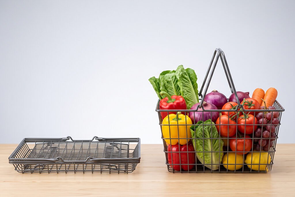 A metal wire basket being folded flat for easy storage next to an expanded basket.
