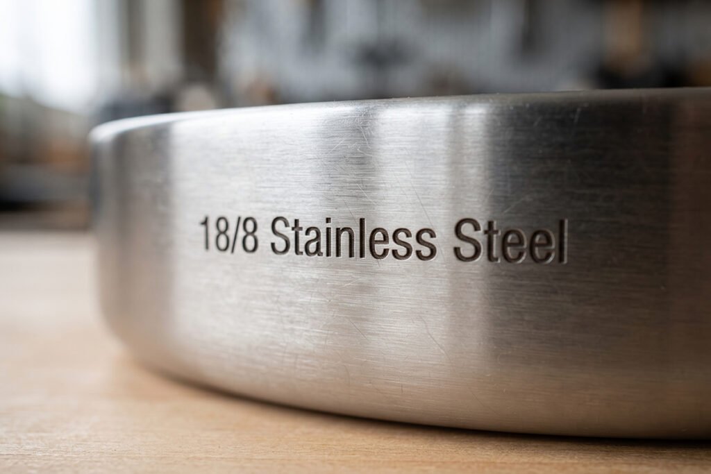 Engraved label on a high-grade stainless steel container indicating 188 alloy composition