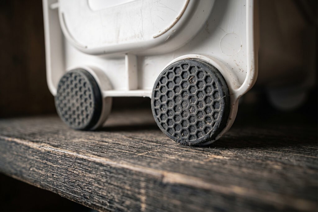 Underside of storage organizer showing non-slip rubber grip feet